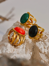 Load image into Gallery viewer, Add a bold touch of color to your ensemble with this eye-catching open adjustable ring, featuring a choice of rich red, black, or green natural stones. Crafted from high-quality stainless steel and plated in radiant gold, this ring combines elegance with everyday practicality—its waterproof finish ensures long-lasting beauty and shine. The open, adjustable design offers a comfortable and versatile fit, making it perfect for women who love versatile yet luxurious accessories. 
