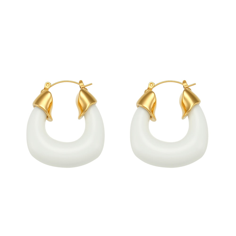 Add a pop of color to your summer look with these bold and stylish chunky resin hoop earrings! Available in vibrant blue or classic white, these lightweight hoops are crafted from durable, waterproof stainless steel for all-day wear. Perfect for vacations, beach days, or everyday outfits, they’re your new go-to statement accessory!