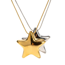 Load image into Gallery viewer, This statement stainless steel necklace comes in a gold and silver colour. It is adorned with a big bulging star pendant that is in contrast with a fine thin chain. This contrast makes it a perfect accessory for any rock glam outfit. The necklace has lobster clasp and adjustable chain.
