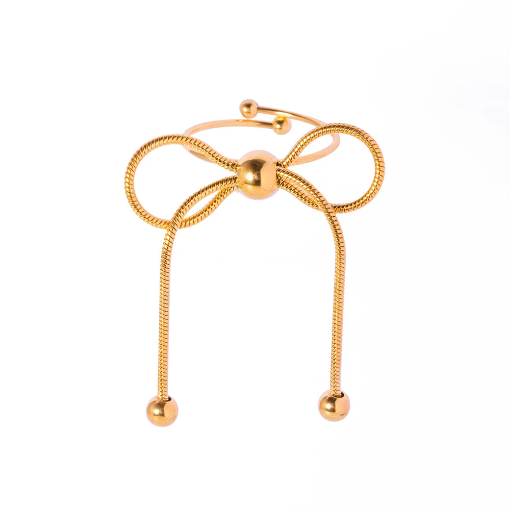 This elegant open slim ring features a charming bow design with delicate tassel accents, crafted from durable stainless steel and plated in radiant 18K gold. Waterproof and stylish, it’s perfect for daily wear or special occasions, offering a blend of sophistication and modern flair. A versatile accessory for women and girls, this new arrival adds a graceful touch to any jewelry collection.