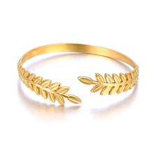 Load image into Gallery viewer, Elevate your style with this fashion stainless steel open charm bracelet. Featuring a stunning golden leaf plant design, this statement piece adds a touch of nature-inspired elegance to any outfit. Durable, waterproof, and crafted for lasting shine, it’s perfect for women who love versatile and eye-catching jewelry. Ideal for daily wear or as a thoughtful gift.
