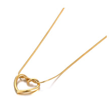 Load image into Gallery viewer, Stainless steel necklace comes in two colours: gold and silver. This simple and elegant necklace is adorned with a twisted hollow heart pendant. It is a perfect piece for an elegant occasion outfit as well as for daily combinations. The necklace has a size adjustable chain with a lobster clasp.&nbsp;
