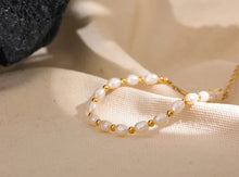 Load image into Gallery viewer, Embrace timeless elegance with this stunning natural freshwater pearl and stainless steel bead bracelet. Expertly handcrafted, this bracelet alternates lustrous freshwater pearls with polished stainless steel beads, creating a harmonious blend of classic and contemporary style. Finished with waterproof PVD coating, this durable piece is designed for everyday wear while maintaining its exquisite beauty. 
