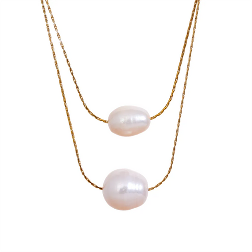 This glamorous stainless steel necklace features an elegant double chain design, each strand adorned with a single, lustrous natural freshwater pearl. The larger pearls add a touch of sophistication and elevate the necklace's overall style, making it a striking accessory. Perfect for complementing an evening outfit or adding a touch of elegance to your daily look, this versatile piece is both stylish and refined. The necklace is finished with a secure lobster clasp and an adjustable chain.