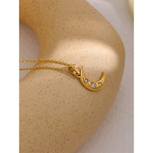 Load image into Gallery viewer, This romantic stainless steel necklace comes in a gold colour. Its has very mice thin chain which is adorned with a nice moon pendant. The moon has several cubic zirconia on its surface which makes it more chic and glamorous. The chain necklace is perfect for spicing up your daily or evening outfit. It has lobster clasp and adjustable length.
