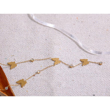 Load image into Gallery viewer, This beautiful and elegant 18K plated stainless steel necklace comes in a gold colour. It is adorned with small cubic zirconia pendants and stainless steel butterflies. There is a small chain hanging at the bottom of the necklace also adorned with the same pattern. This chic necklace is perfect for spicing up your evening outfit. It has lobster clasp and adjustable length.
