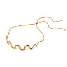 Load image into Gallery viewer, This elegant wave choker necklace features a striking wave design at the front, crafted from stainless steel with a radiant gold-plated finish for a modern, sophisticated look. The adjustable length and long, graceful chains at the back add versatility and a touch of drama. Perfect as a bold statement piece or a thoughtful gift, this necklace enhances any outfit with its unique charm and elegance.
