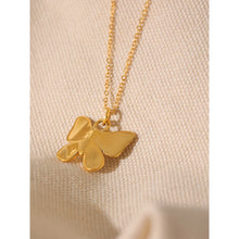 Load image into Gallery viewer, This romantic 18K gold plated stainless steel necklace comes in a gold colour. Its delicate and thin chain is adorned with a beautiful carved butterfly pendant that is additionally adorned with small artificial pearls and cubic zirconia. The chain necklace is perfect for spicing up your daily or evening outfit. It has lobster clasp and adjustable length.
