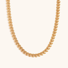 Load image into Gallery viewer, Elevate your style with this elegant leaves fishtail chain necklace, crafted from gold-plated stainless steel for a timeless shine. Featuring a delicate leaf-inspired design, this necklace adds a touch of nature-inspired elegance to any outfit. Durable and stylish, it’s perfect for both everyday wear and special occasions. A must-have addition to any jewelry collection or a thoughtful gift for someone special.
