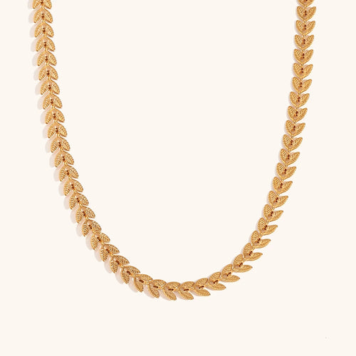 Elevate your style with this elegant leaves fishtail chain necklace, crafted from gold-plated stainless steel for a timeless shine. Featuring a delicate leaf-inspired design, this necklace adds a touch of nature-inspired elegance to any outfit. Durable and stylish, it’s perfect for both everyday wear and special occasions. A must-have addition to any jewelry collection or a thoughtful gift for someone special.