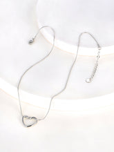 Load image into Gallery viewer, Stainless steel necklace comes in two colours: gold and silver. This simple and elegant necklace is adorned with a twisted hollow heart pendant. It is a perfect piece for an elegant occasion outfit as well as for daily combinations. The necklace has a size adjustable chain with a lobster clasp.&nbsp;
