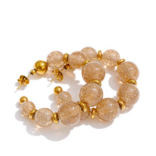 Load image into Gallery viewer, Add a touch of modern elegance to your look with these resin round beads chain C-Shape huggie earrings. Handmade with care, they feature glossy resin round beads paired with a sleek stainless steel chain for a lightweight yet durable finish. Inspired by trendy French fashion, these C-shape huggie earrings offer a stylish balance of chic and contemporary design, making them perfect for everyday wear or special occasions. A must-have statement accessory for women who love unique, fashionable jewelry.
