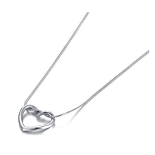 Load image into Gallery viewer, Stainless steel necklace comes in two colours: gold and silver. This simple and elegant necklace is adorned with a twisted hollow heart pendant. It is a perfect piece for an elegant occasion outfit as well as for daily combinations. The necklace has a size adjustable chain with a lobster clasp.&nbsp;
