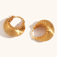 Load image into Gallery viewer, These trendy hoop earrings feature a charming basket boat shape with a unique edge design accented by small, delicate ball details. Crafted from durable stainless steel, they bring a playful yet sophisticated touch to any outfit, making them perfect for adding interest to everyday looks. 
