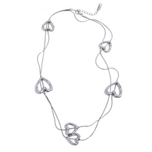 Load image into Gallery viewer, Add a touch of romance to your look with this stunning 85cm stainless steel heart contour charm necklace, available in both silver and gold finishes. Elegantly designed, this long chest chain features delicate heart-shaped charms spread along the length of the chain, creating a subtle yet captivating statement of love. Crafted from durable, waterproof stainless steel, this piece ensures lasting shine and beauty, making it perfect for both everyday wear and special occasions. 
