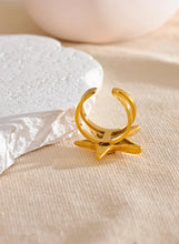 Load image into Gallery viewer, Embrace the essence of summer with this stainless steel starfish open ring, a playful and elegant accessory perfect for your holiday look. 18K gold plated for a luxurious finish, this adjustable ring features a charming starfish design that brings a touch of the ocean to your style. Crafted for durability and comfort, it’s an ideal piece for those who love personalized, summer-inspired jewelry.
