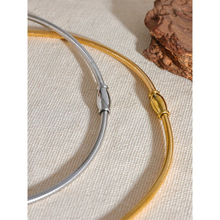 Load image into Gallery viewer, Stainless steel choker necklace comes in gold and silver colour. It is adorned with an interesting cilindar shape which makes this necklace, although simple, still very interesting. The necklace has magnetic clasp and it is a perfect accessory to any evening dress or suit.
