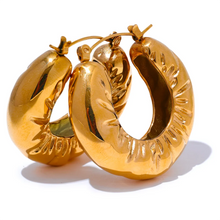 Load image into Gallery viewer, These elegant, chunky hoop earrings are crafted from durable stainless steel with a radiant gold finish, designed to bring a touch of sophistication to everyday looks. Featuring a unique crumpled texture along the edges, they add a modern twist to the classic hoop, making them a standout piece for any occasion. Lightweight yet bold, these hollow hoops are perfect for daily wear and make a thoughtful gift for any woman who appreciates stylish, personalized jewelry.
