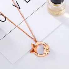 Load image into Gallery viewer, This elegant 18K gold plated necklace is made of stainless steel and comes in a rose gold colour. It is adorned with a beautiful pendant in a shape of a circle. There are three butterflies on the circle as well as two cubic zirconia which makes this pendant very elegant and classy. This necklace is a perfect accessory for a glamorous outfit. It has a size adjustable chain with a lobster clasp.&nbsp;
