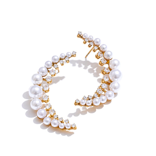 Add a touch of elegance to your look with these high-grade moon stud earrings, featuring dazzling cubic zirconia and luminous simulated pearls. Crafted from durable stainless steel, these delicate earrings offer a timeless yet modern charm, perfect for both casual and formal occasions. A stylish and sophisticated gift, they make a stunning addition to any jewelry collection.