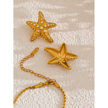 Load image into Gallery viewer, These stunning stud earrings, crafted from stainless steel, feature striking starfish pendants that exude summer elegance. Each starfish is beautifully adorned with sparkling cubic zirconia, adding a radiant touch of glamour and sophistication to your look. Perfect for complementing any summer outfit, these earrings effortlessly bring a hint of coastal charm and eye-catching sparkle. 
