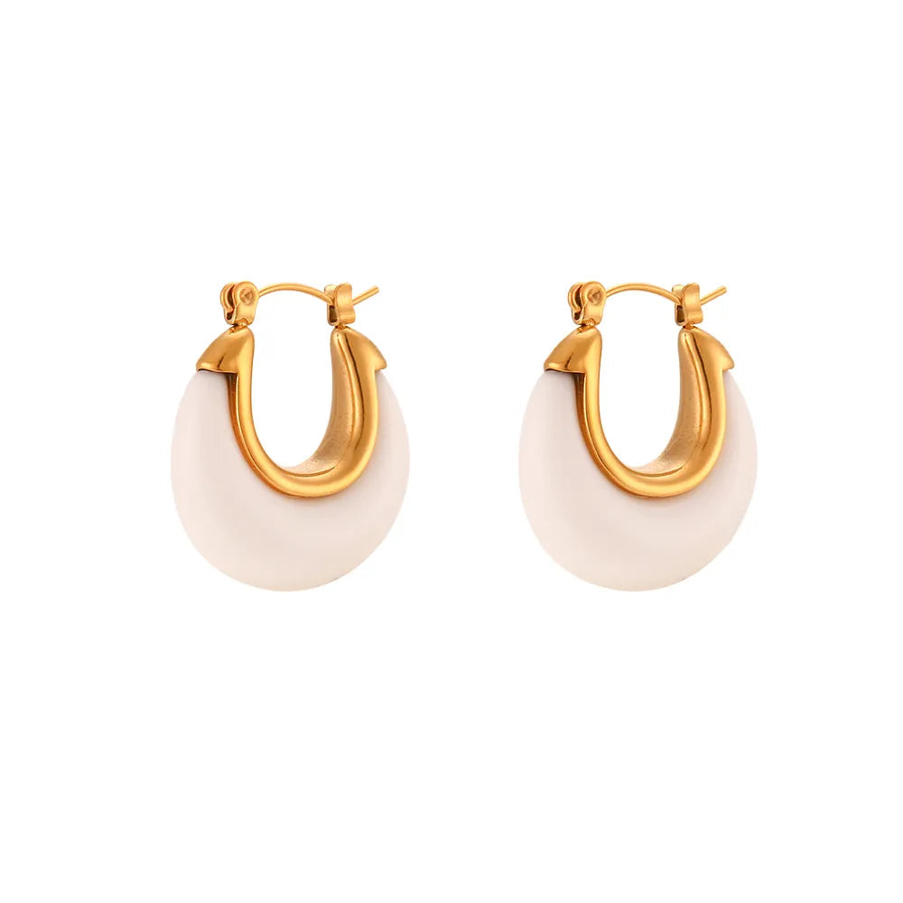 Elevate your everyday style with these chic acrylic white hoop earrings, featuring a delicate gold inner line for a touch of luxe. The small, round design paired with a sturdy stainless steel hoop makes them both stylish and durable. Whether you're dressing up or down, these versatile earrings add a perfect pop of modern elegance to any outfit.