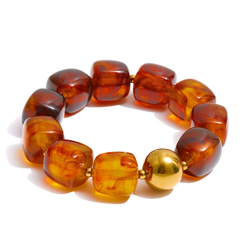 Add a pop of color and personality to your look with this handmade acrylic bead bracelet, featuring a stunning mix of green, beige, pink, and amber tones. Crafted from durable stainless steel and fully waterproof, it’s made to shine with you every day. The bold square beads and modern chain design create a playful yet elegant look that stands out effortlessly. Perfect for stacking, gifting, or wearing solo, this bracelet brings a touch of fun, color, and sophistication to any outfit.