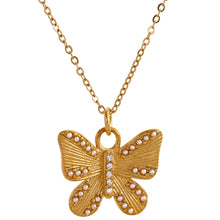 Load image into Gallery viewer, This romantic 18K gold plated stainless steel necklace comes in a gold colour. Its delicate and thin chain is adorned with a beautiful carved butterfly pendant that is additionally adorned with small artificial pearls and cubic zirconia. The chain necklace is perfect for spicing up your daily or evening outfit. It has lobster clasp and adjustable length.
