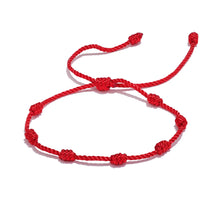 Load image into Gallery viewer, Embrace the power of tradition and style with the adjustable red rope bracelet, expertly handcrafted with braided nodes to symbolize luck, wealth, and good fortune. This meaningful piece is designed for both women and men, making it a thoughtful gift for loved ones or a charming addition to your own collection. The adjustable design ensures a perfect fit for any wrist, while the vibrant red color adds a bold touch to any look. 
