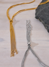 Load image into Gallery viewer, Elevate your style with this popular stainless steel long tassel necklace, featuring an 18K PVD gold plating for a luxurious finish. Its sleek, sweater chain design adds a trendy yet timeless touch to any outfit, making it perfect for layering or wearing alone. Durable and stylish, this personalized fashion piece is ideal for everyday wear or as a thoughtful gift for someone special.
