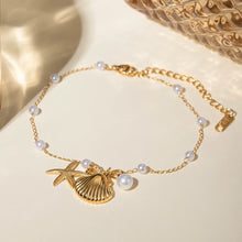 Load image into Gallery viewer, This exquisite gold-tone stainless steel anklet is the ultimate summer accessory, designed to elevate any warm-weather look. The delicate chain is adorned with flawless pearl imitations and three charming pendants—a starfish, a seashell, and a pearl—evoking the beauty of the sea and adding a touch of coastal elegance. With its secure lobster clasp and adjustable chain, this anklet offers a comfortable, customizable fit.
