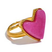 Load image into Gallery viewer, Add a playful touch to your style with this candy sweet natural stone heart open ring. Crafted from stainless steel and plated in real gold, this adjustable ring features a charming heart-shaped natural stone centerpiece, evoking the fun and vibrant energy. Its open design ensures a comfortable, custom fit, making it perfect for everyday wear or as a standout accessory for special occasions.
