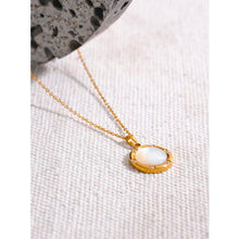 Load image into Gallery viewer, Stainless steel delicate necklace comes in a gold colour. It is made of fine and thin link chain and it has beautiful round pendant . Pendant is made of natural shell and it is circled with a fine golden border. It is also additionally adorned with small zircons which gives the necklace chic and stylish look. This necklace can be worn with any daily outfit. It has lobster clasp and adjustable length.
