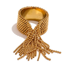 Load image into Gallery viewer, Make a bold statement with this stainless steel chain tassel finger ring, featuring an eye-catching adjustable design in both gold and silver 18K plated finishes. Crafted from high-quality stainless steel, this stylish ring combines elegance with modern charm. The delicate chain tassel detail adds a unique touch, making it a perfect accessory for any fashion-forward jewelry lover. Ideal for both casual and special occasions!
