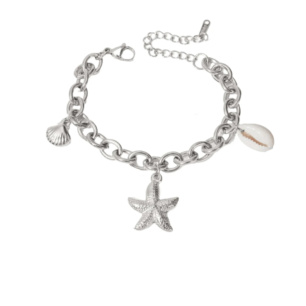 Add a touch of seaside charm to your look with this summer stainless steel bracelet. Plated in radiant 18K gold and designed with a delicate drop chain, this stylish bracelet features playful shells and starfish charms that capture the essence of summer. Waterproof and durable, it's perfect for everyday wear, whether you're at the beach or adding a touch of whimsy to your daily outfit. 