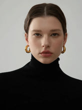 Load image into Gallery viewer, These elegant, chunky hoop earrings are crafted from durable stainless steel with a radiant gold finish, designed to bring a touch of sophistication to everyday looks. Featuring a unique crumpled texture along the edges, they add a modern twist to the classic hoop, making them a standout piece for any occasion. Lightweight yet bold, these hollow hoops are perfect for daily wear and make a thoughtful gift for any woman who appreciates stylish, personalized jewelry.
