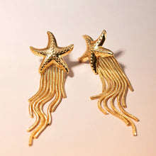 Load image into Gallery viewer, Elevate your style with these stunning stainless steel starfish dangle stud earrings, featuring long, delicate tassel chains and finely detailed starfish charms. Crafted from waterproof stainless steel, they’re perfect for everyday wear, even in humid or wet conditions. Lightweight and comfortable, these earrings add a touch of coastal elegance to any outfit, whether for a beach getaway or a casual day out. Their secure hooks and timeless design make them a versatile accessory for the modern woman.
