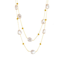 Load image into Gallery viewer, This elegant double-layer necklace combines the timeless beauty of a delicate thin stainless steel chain with the classic allure of freshwater pearls, creating a refined accessory perfect for any occasion. Its layered design adds depth and sophistication, making it an ideal choice for parties or stylish everyday wear. Crafted to last, this necklace is both chic and versatile, offering a graceful touch to any outfit and a lovely addition to any jewelry collection.
