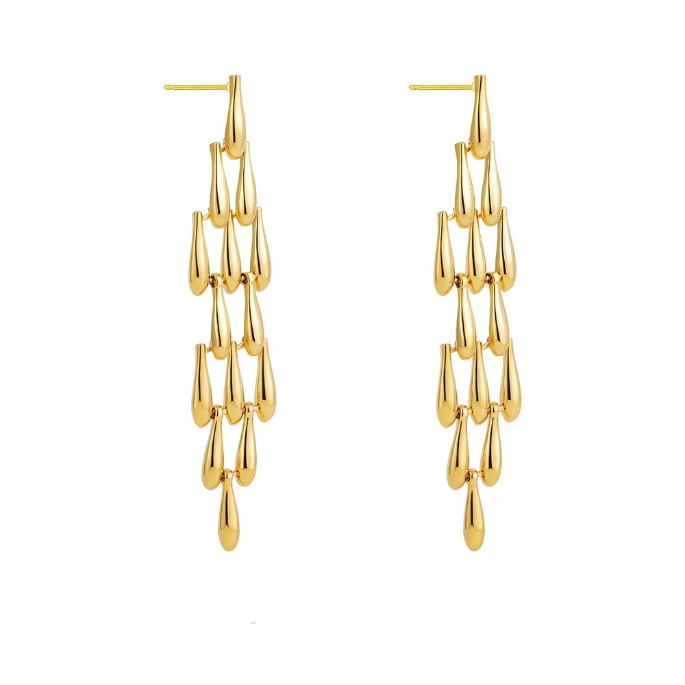 These creative teardrop earrings feature an intricate mesh design, plated in gold for a luxurious yet lightweight look. Crafted from high-quality stainless steel, they include delicate long tassels that add movement and elegance, making them a standout accessory for any occasion. Perfect for those who love stylish, eye-catching jewelry, these earrings offer a chic blend of modern flair and timeless charm, ideal for effortlessly enhancing any outfit.