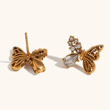 Load image into Gallery viewer, Add a touch of whimsy to your look with these asymmetric mini butterfly earrings, beautifully inlaid with sparkling zirconium. Crafted from durable stainless steel, these earrings are waterproof and perfect for daily wear. Their unique design exudes elegance and charm, making them a stylish accessory or a thoughtful gift for any occasion.
