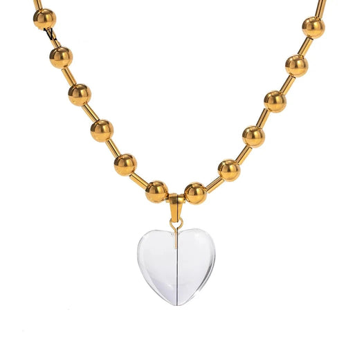 This elegant stainless steel necklace comes in two options, with pink or clear heart pendant. The necklace has a very interesting chain adorned with small stainless steel balls. The heart pendant is made of glass and it makes this necklace a perfect piece for an elegant occasion outfit. The necklace has a lobster clasp and adjustable length. 