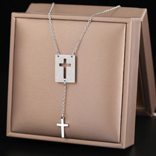 Load image into Gallery viewer, This elegant stainless steel necklace comes in two colours: silver and gold. Its very simple and elegant design is additionally adorned with two pendants: rectangle with a carved cross and a nice cross pendant which hangs from it on a separate chain. It is a perfect piece for an elegant occasion outfit. The necklace has a lobster clasp.&nbsp;
