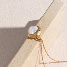 Load image into Gallery viewer, This elegant semi-baroque freshwater-wave pearl pendant necklace is made out of 18K gold plated stainless steel. It can be combined with an elegant dinning or celebration outfit and it can be a perfect gift for a special one.
