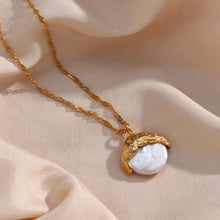 Load image into Gallery viewer, This elegant semi-baroque freshwater-wave pearl pendant necklace is made out of 18K gold plated stainless steel. It can be combined with an elegant dinning or celebration outfit and it can be a perfect gift for a special one.
