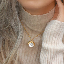 Load image into Gallery viewer, This elegant semi-baroque freshwater-wave pearl pendant necklace is made out of 18K gold plated stainless steel. It can be combined with an elegant dinning or celebration outfit and it can be a perfect gift for a special one.
