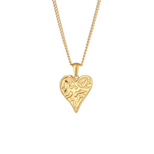 Load image into Gallery viewer, This gorgeous heart pendant necklace is made out of 18K gold plated stainless steel. Heart pedant is adorned with interesting cuts on its surface.The necklace can be perfectly combined with any type of daily or night outfit. It has a size adjustable chain with a lobster clasp. 
