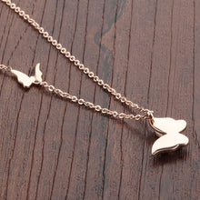 Load image into Gallery viewer, Necklace made of stainless steel comes in two variants: rose gold and silver colour. Necklace is adorned with two beautiful pedants in a shape of a butterfly. The bigger butterfly has one smaller butterfly with sanded surface. The necklace has adjustable length and lobster clasp.
