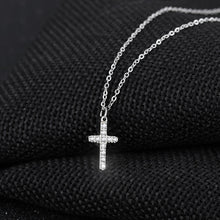 Load image into Gallery viewer,  Simple and elegant necklace is made of 316L stainless steel. It comes in two colours: rose gold and silver. It has a small pedant in a shape of a cross adorned with cubic zirconia. It is perfect for everyday occasions as well as a gift for Baptism, First Holly Communion or Sacrament of Confirmation. The necklace has lobster clasp.
