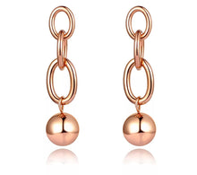 Load image into Gallery viewer, Rock glam stainless steel earrings are made in a rose gold and silver colour. They consists of three chain links. There is a ball at the bottom connected to them. Earrings are three times gold plated and represent great accessory for your rock glam styling. They have stud fastening.
