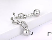 Load image into Gallery viewer, Rock glam stainless steel earrings are made in a rose gold and silver colour. They consists of three chain links. There is a ball at the bottom connected to them. Earrings are three times gold plated and represent great accessory for your rock glam styling. They have stud fastening.
